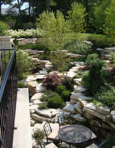 Sunken garden with ledgerock outcroppings and water features