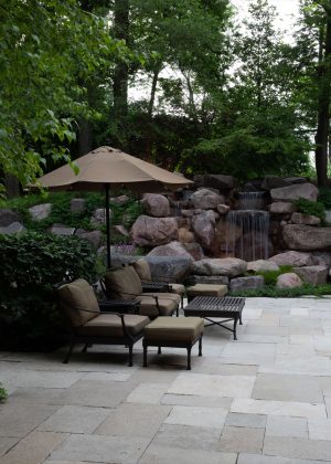 Bluestone patio with boulder water feature