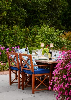 Bluestone patio with a marble table set for a dinner party