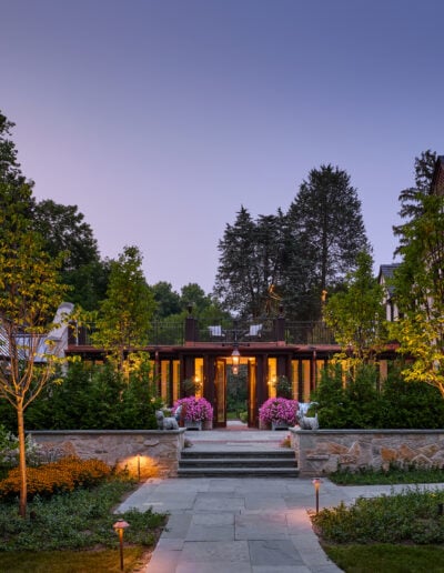 bluestone deck with stone wall at night