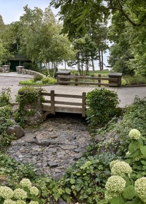 Brick bridge over stone waterfall